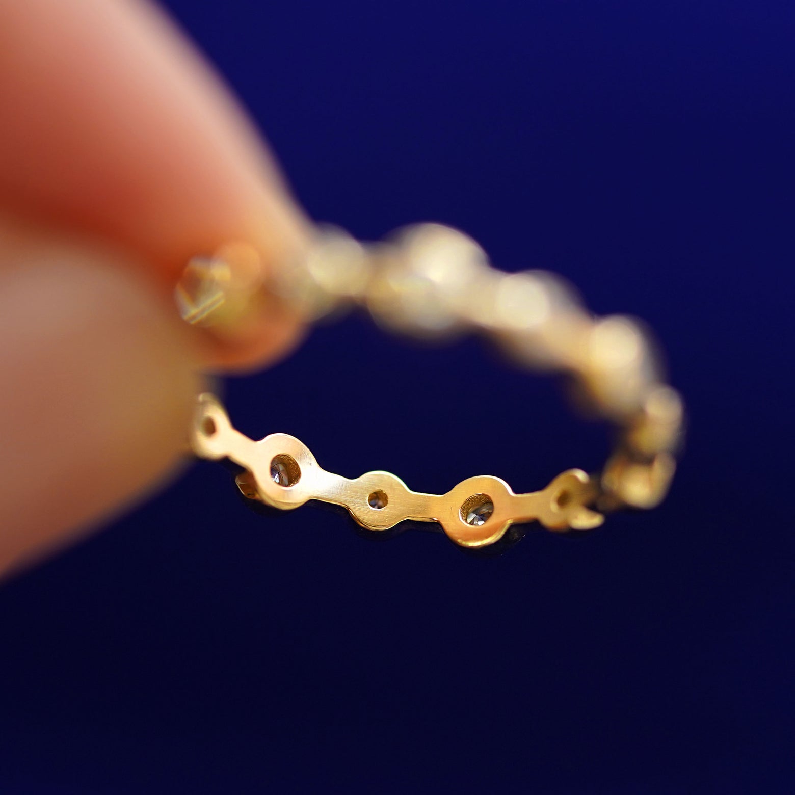 Underside view of a solid 14k gold Infinity Diamond Ring