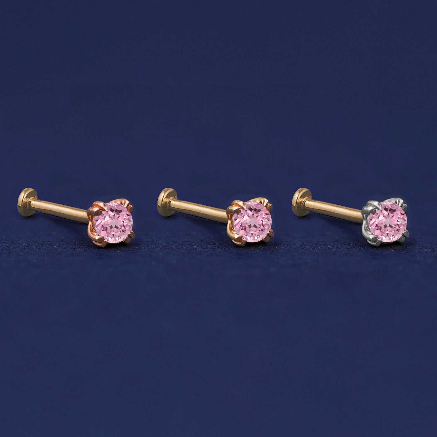 Three versions of the Pink Sapphire Flat Back Stud shown in options of rose, yellow, and white gold