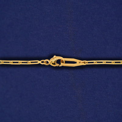 Close up view of an Automic Gold AU clasp on a solid 14k yellow gold Butch Chain