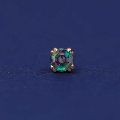 Front facing view of a 14k yellow gold Alexandrite Flat Back Earring