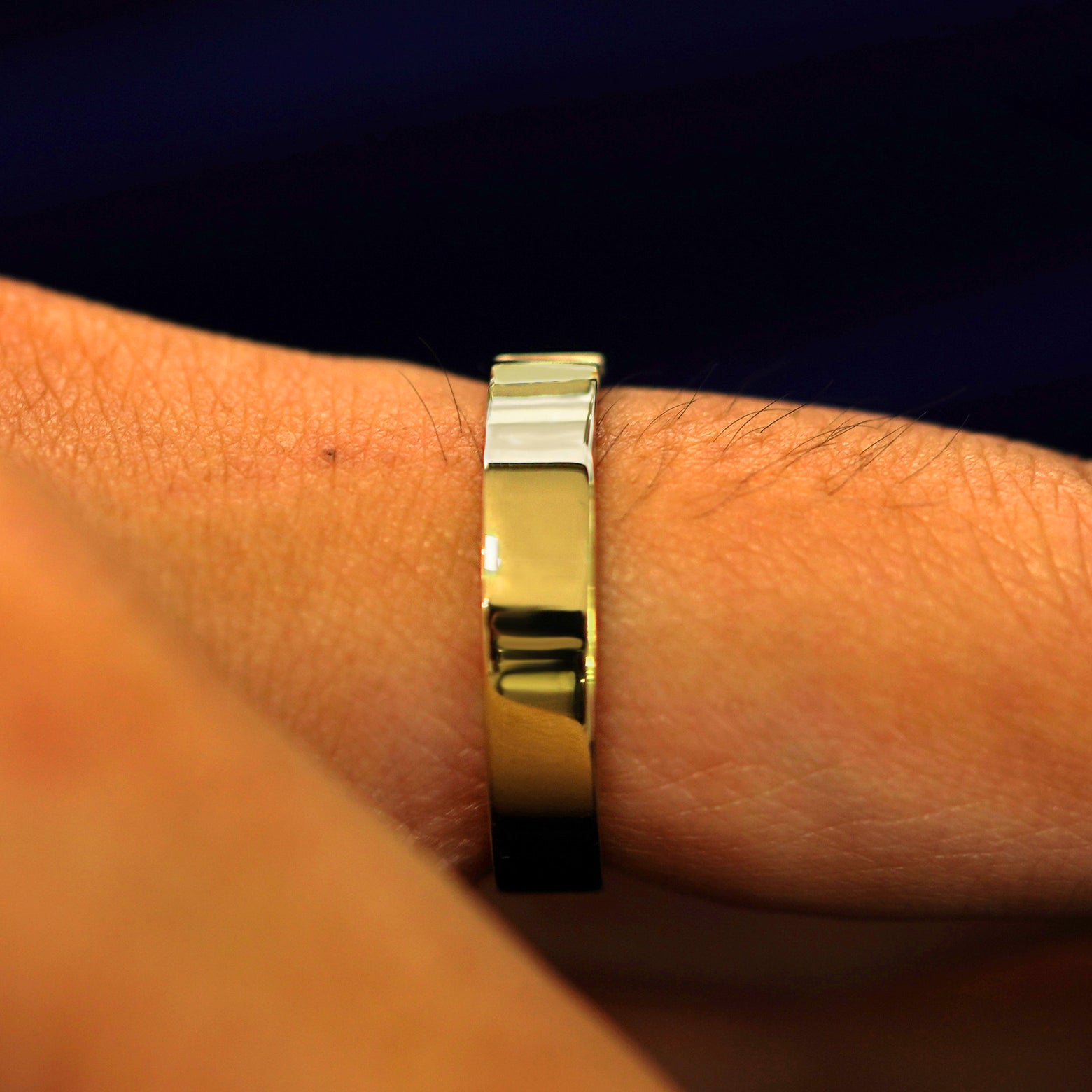 Side view of a Double Baguette Diamond Band on a model's finger