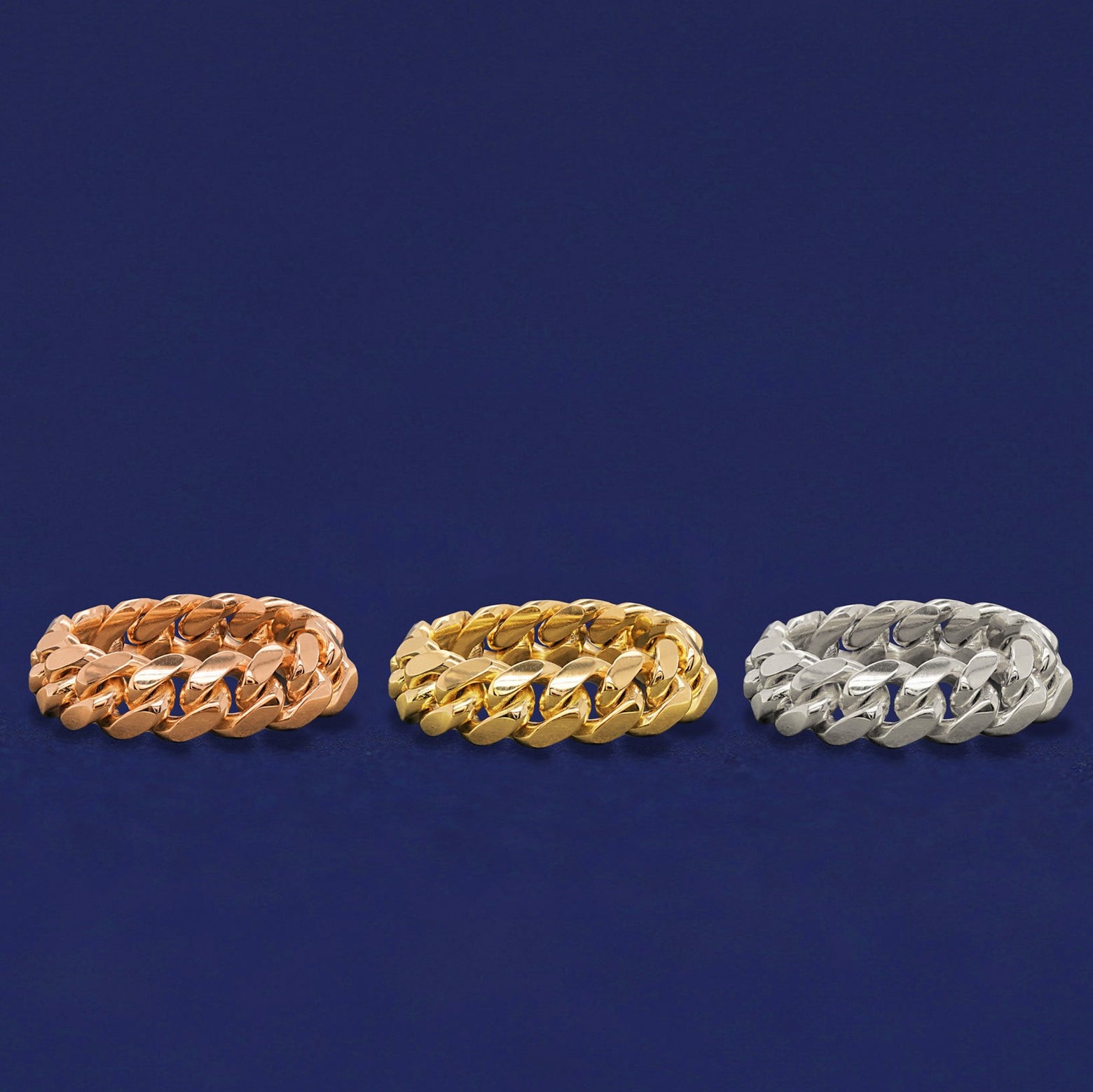 Three versions of the Miami Cuban Ring in options of rose, yellow, and white gold