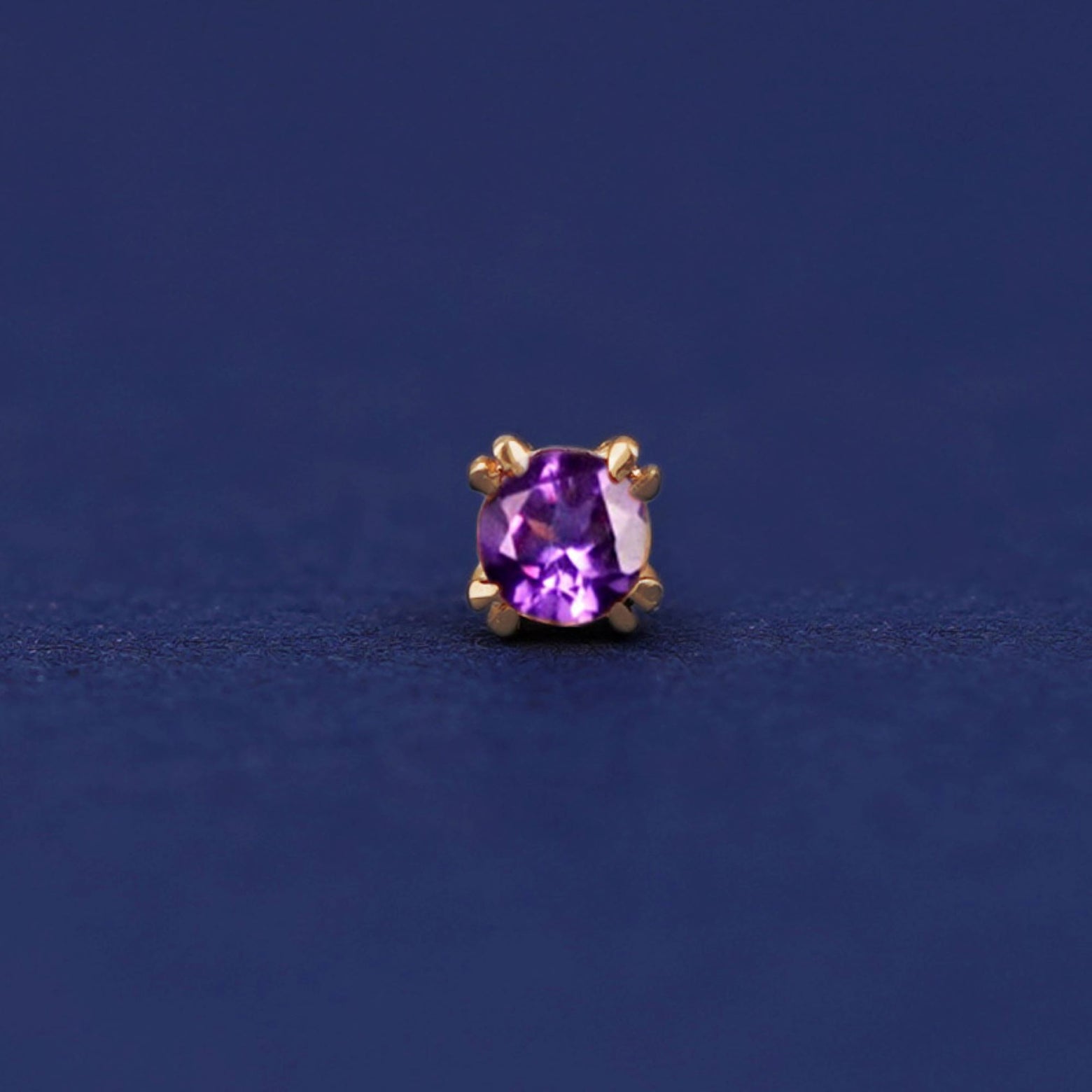 Front facing view of a 14k yellow gold Amethyst Flat Back Earring