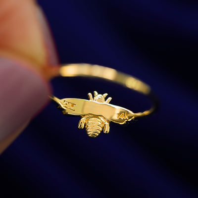 Underside view of a solid gold Bee Ring