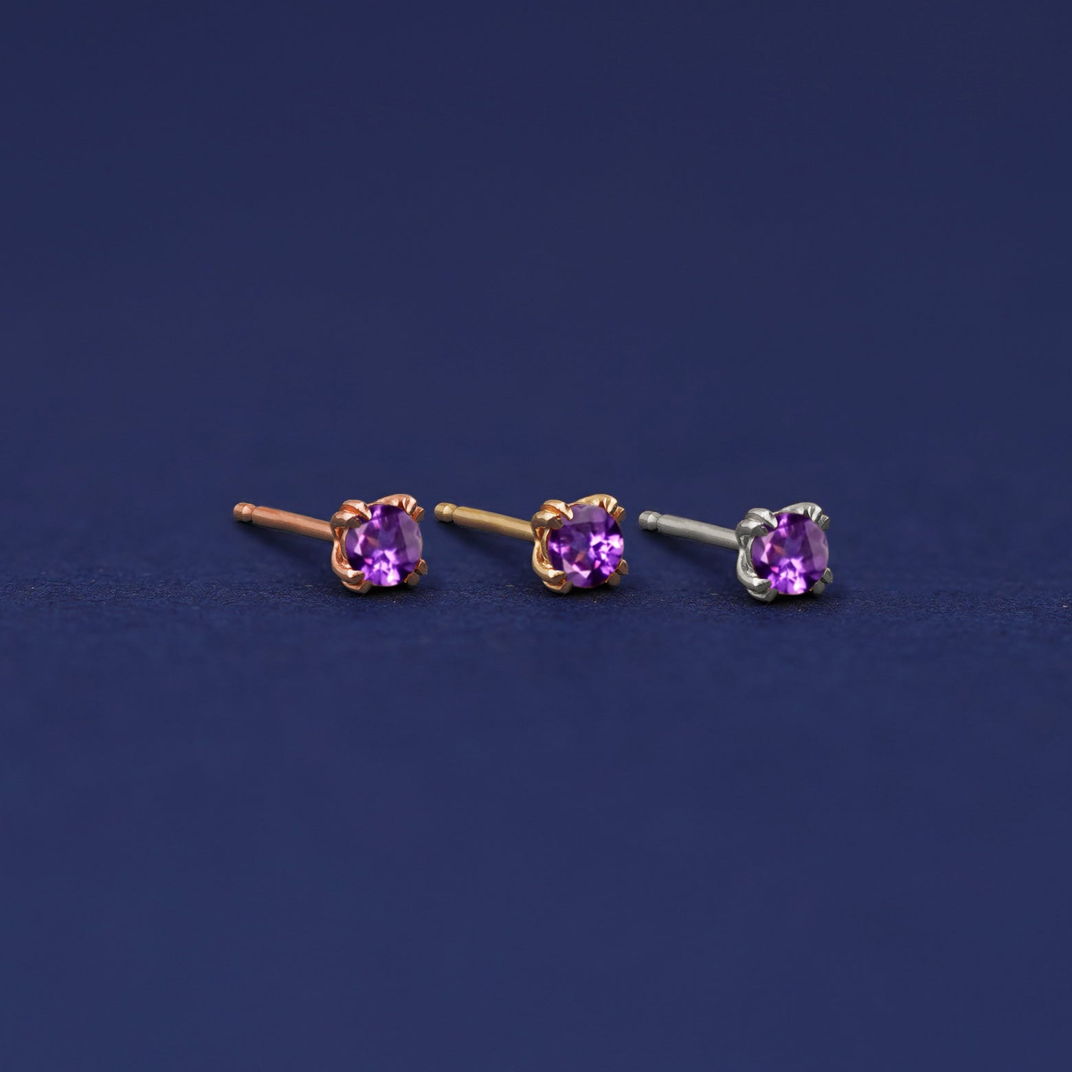 Three versions of the Amethyst Earring shown in options of rose, yellow, and white gold