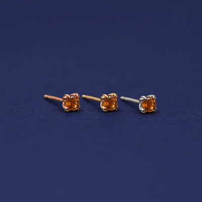 Three versions of the Citrine Earring shown in options of rose, yellow, and white gold