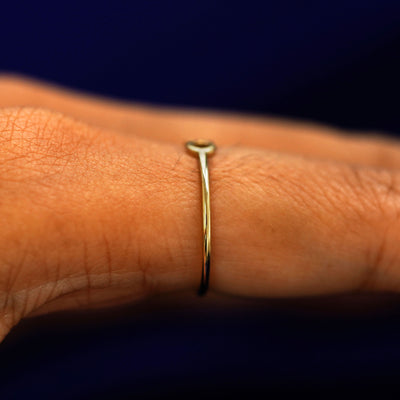 Side view of a Infinity Ring on a model's finger