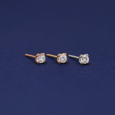 Three versions of the Moissanite Earring shown in options of rose, yellow, and white gold