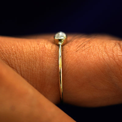 Side view of a Moonstone Ring on a model's finger