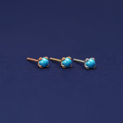 Three versions of the Turquoise Earring shown in options of rose, yellow, and white gold