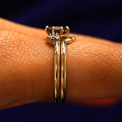 Side view of an Alexandrite Cluster Ring Set on a model's finger