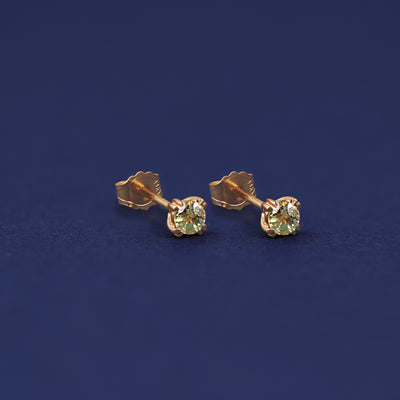 Yellow gold Peridot Earrings shown with 14k solid gold pushback backings