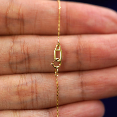 An Automic Gold AU spring ring clasp on a Essential Chain
