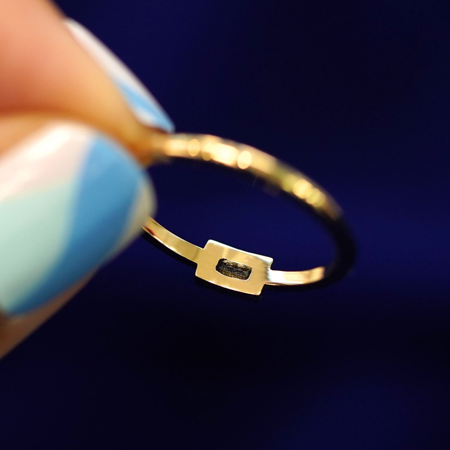 Underside view of a solid 14k gold Baguette Salt and Pepper Diamond Ring