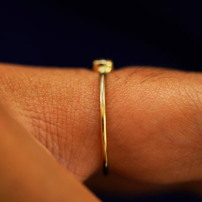 Side view of an Aquamarine Ring on a model's finger