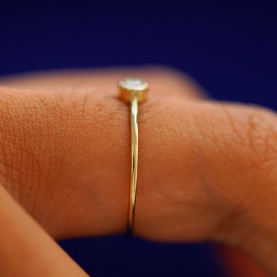 Side view of a Diamond Ring on a model's finger