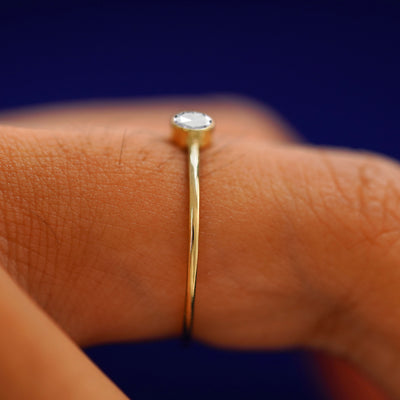 Side view of a solid gold Rose Cut Diamond Ring on a model's finger