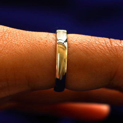 Side view of a Square Carre Cut Diamond Band on a model's finger