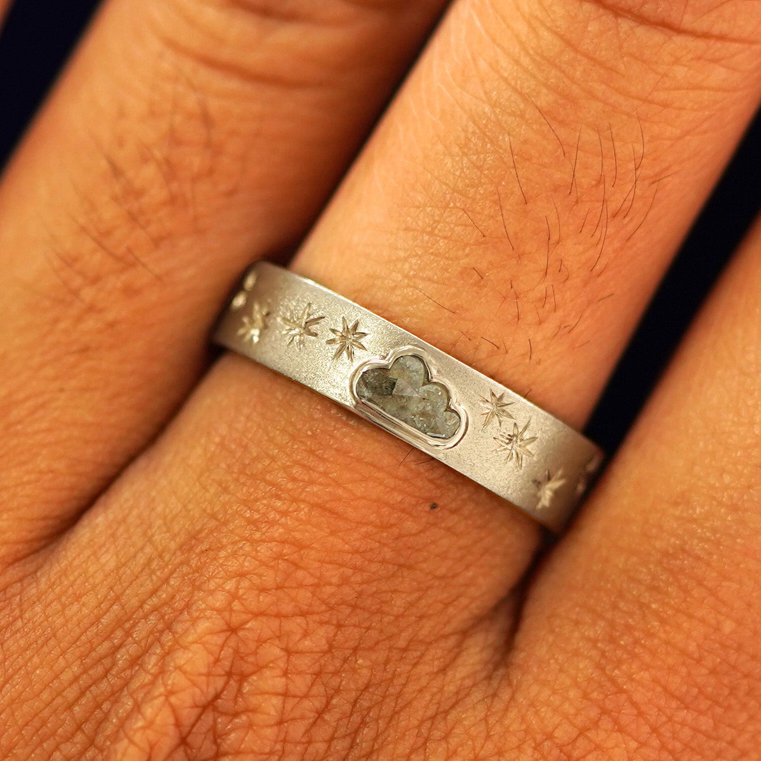 Close up view of a model's fingers wearing a 14k champagne gold Cloud Diamond Band