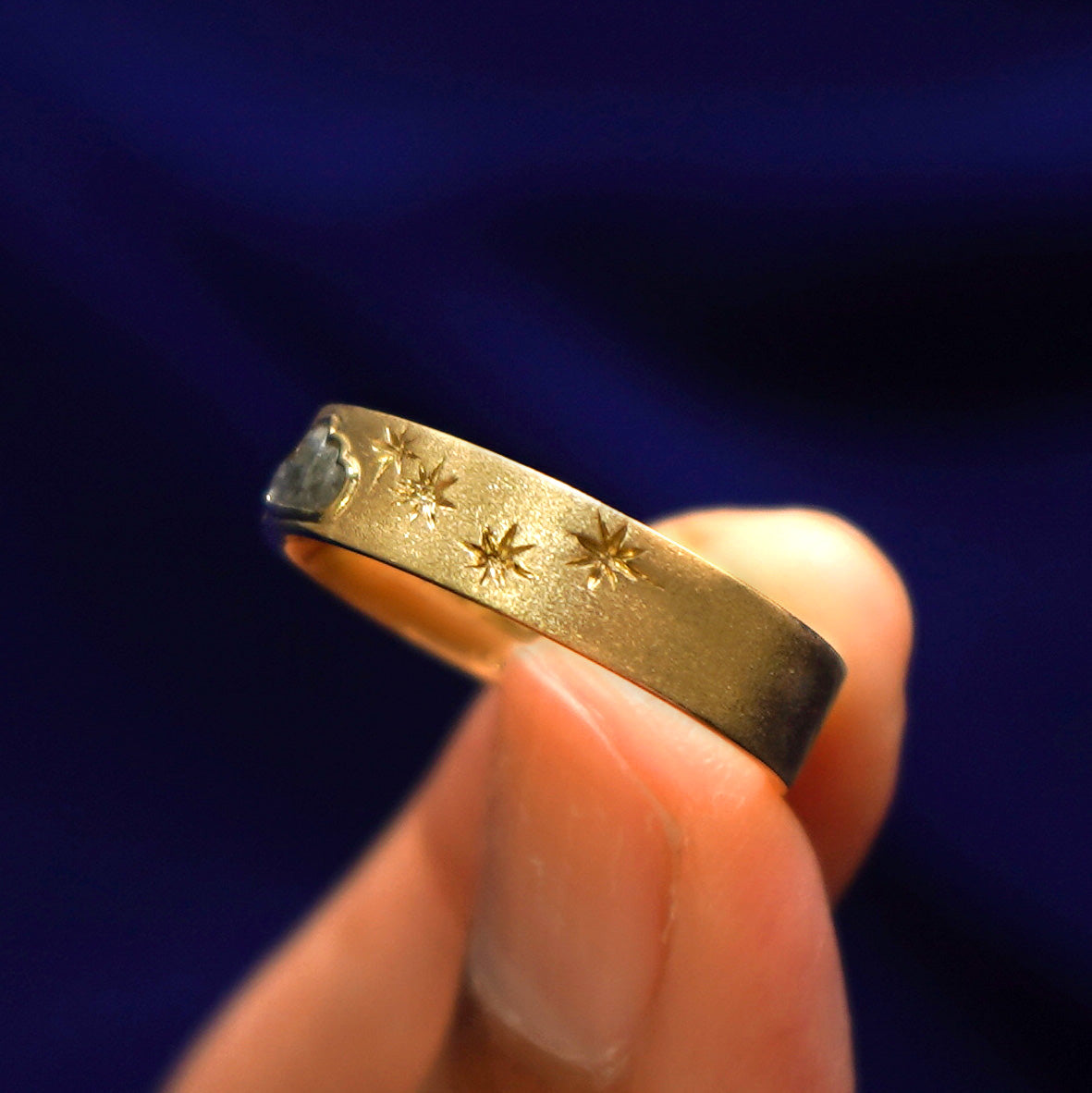 Side view of a Cloud Diamond Band showing hand etched stars halfway down the band