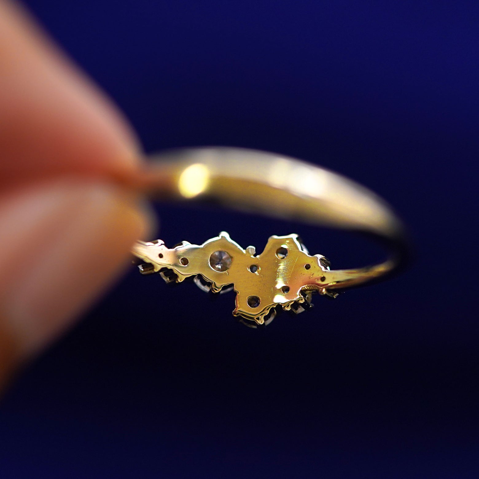 Underside view of a solid 14k gold Diamond Cluster Ring