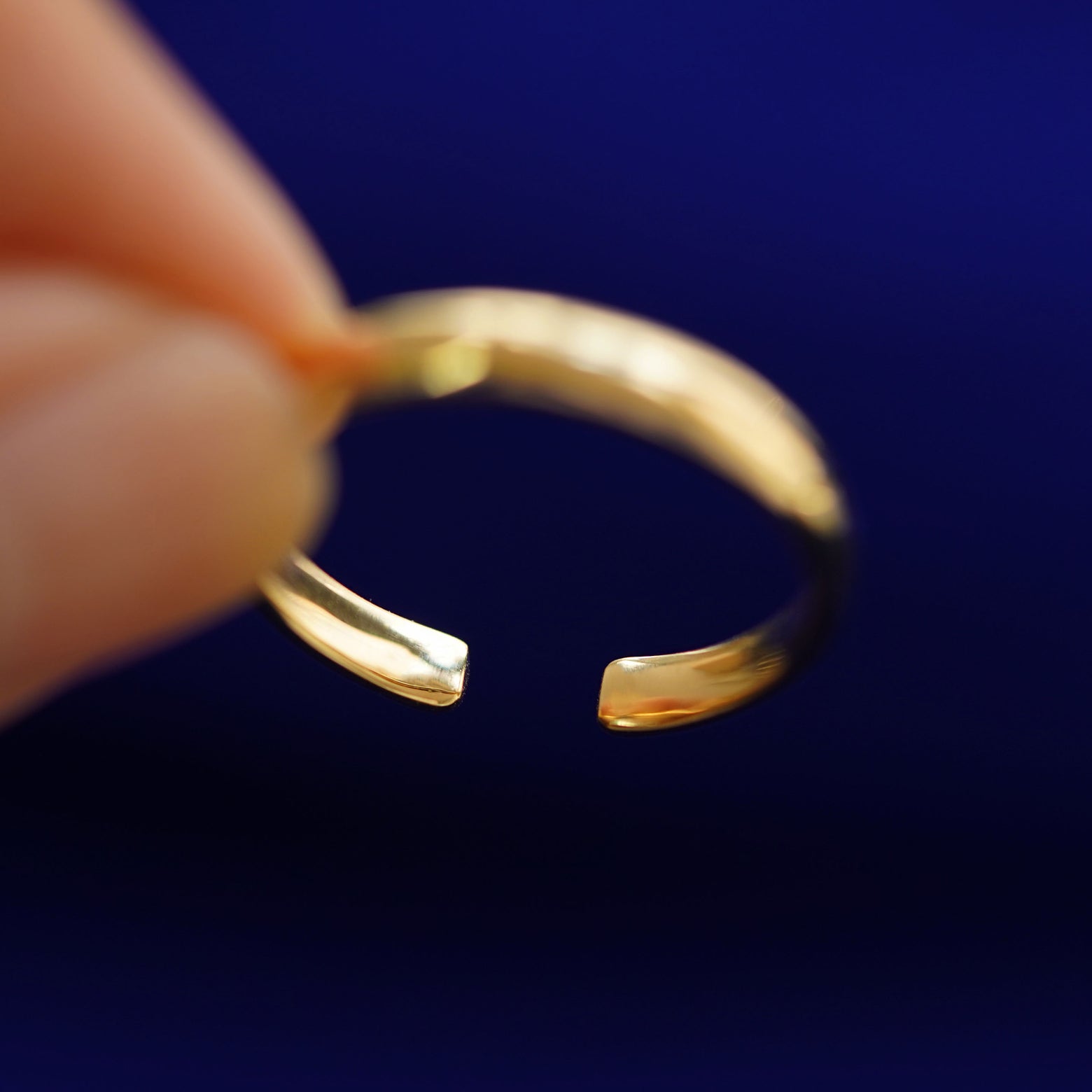 Underside view of a solid 14k gold Open Curvy Band