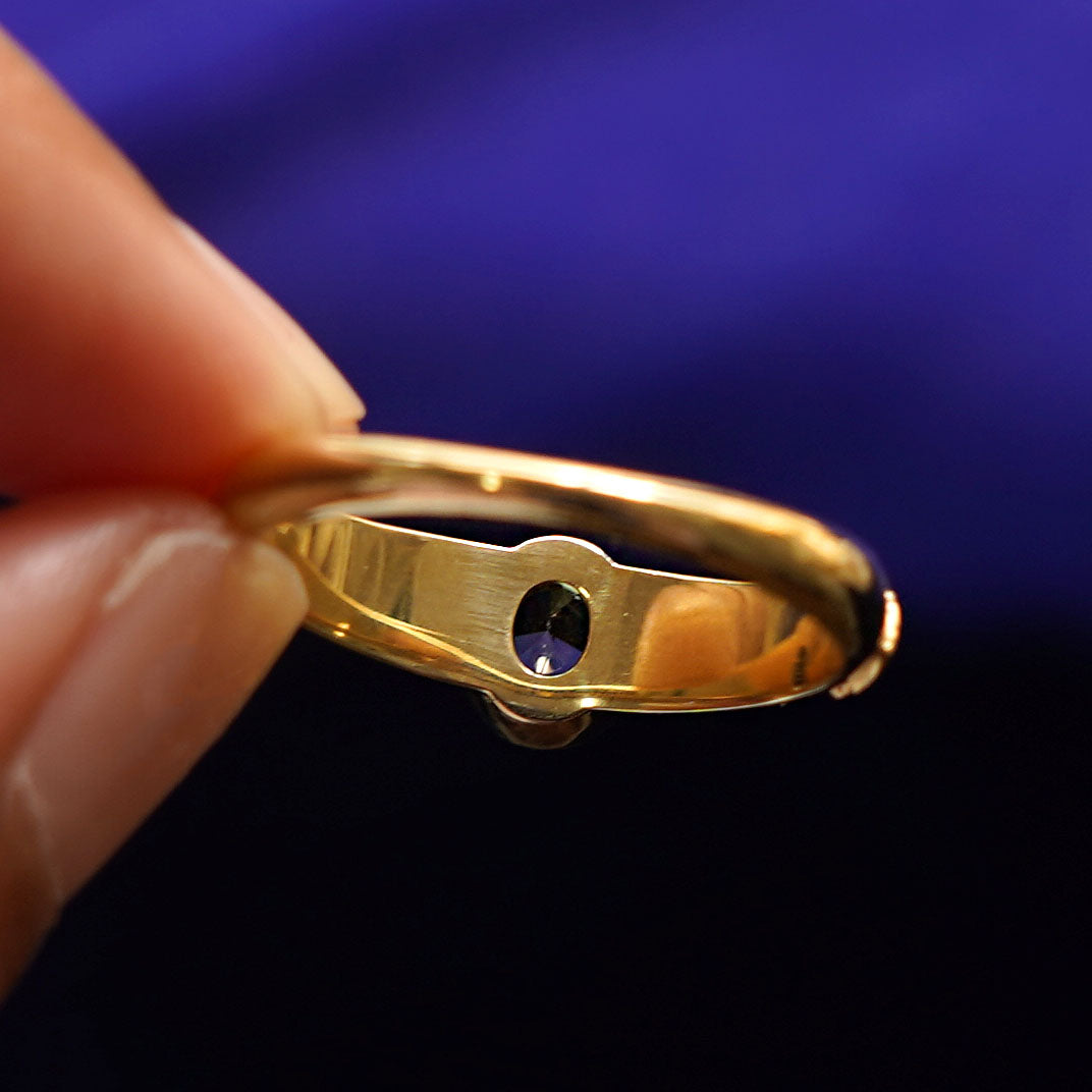 Underside view of a solid 14k gold Dark Green Sapphire Pine Ring