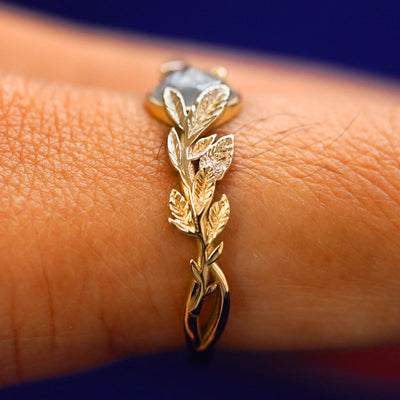 Side view of a Diamond Leaves Ring on a model's finger