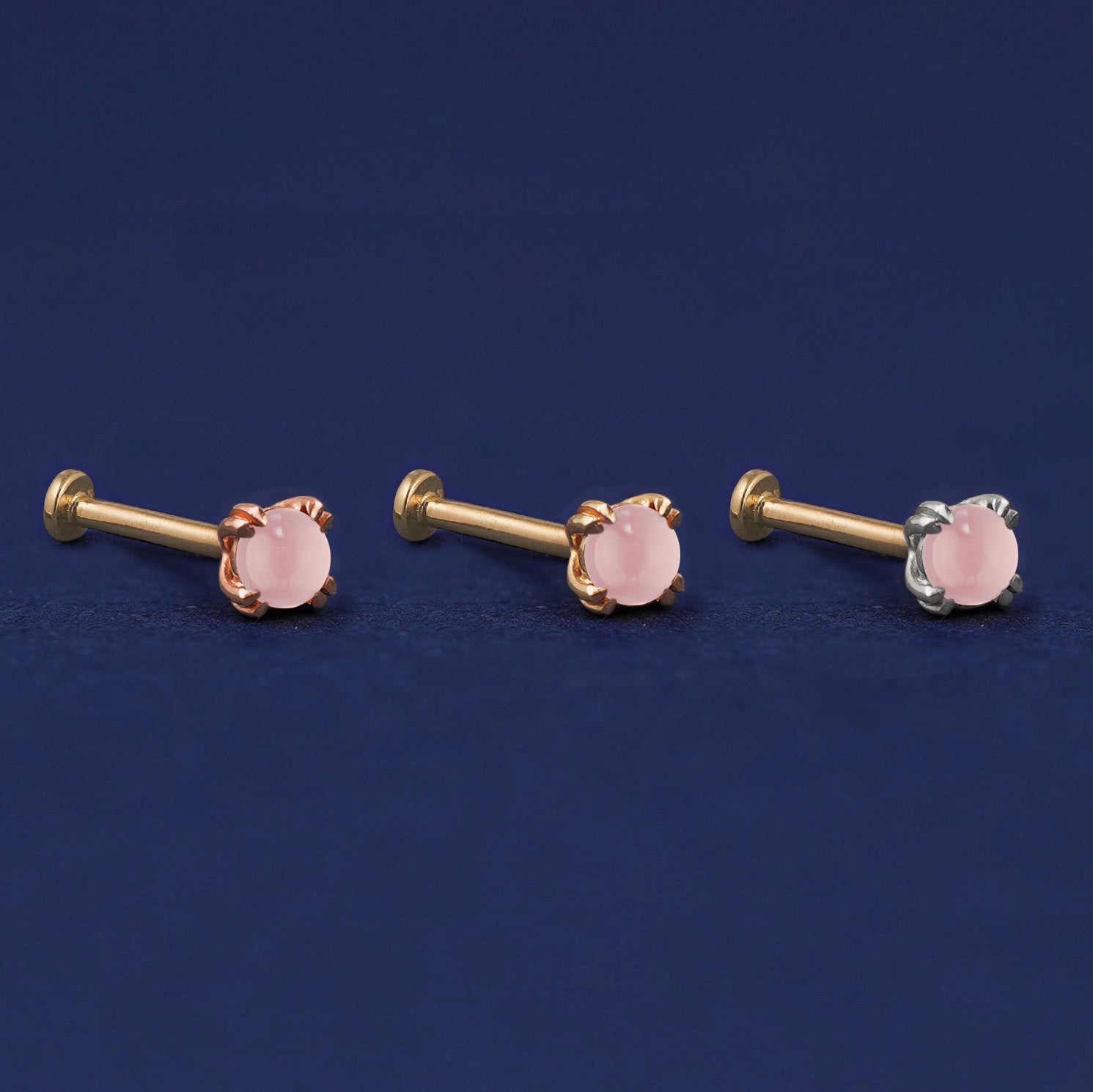 Three versions of the Rose Quartz Flat Back Earring shown in options of rose, yellow, and white gold