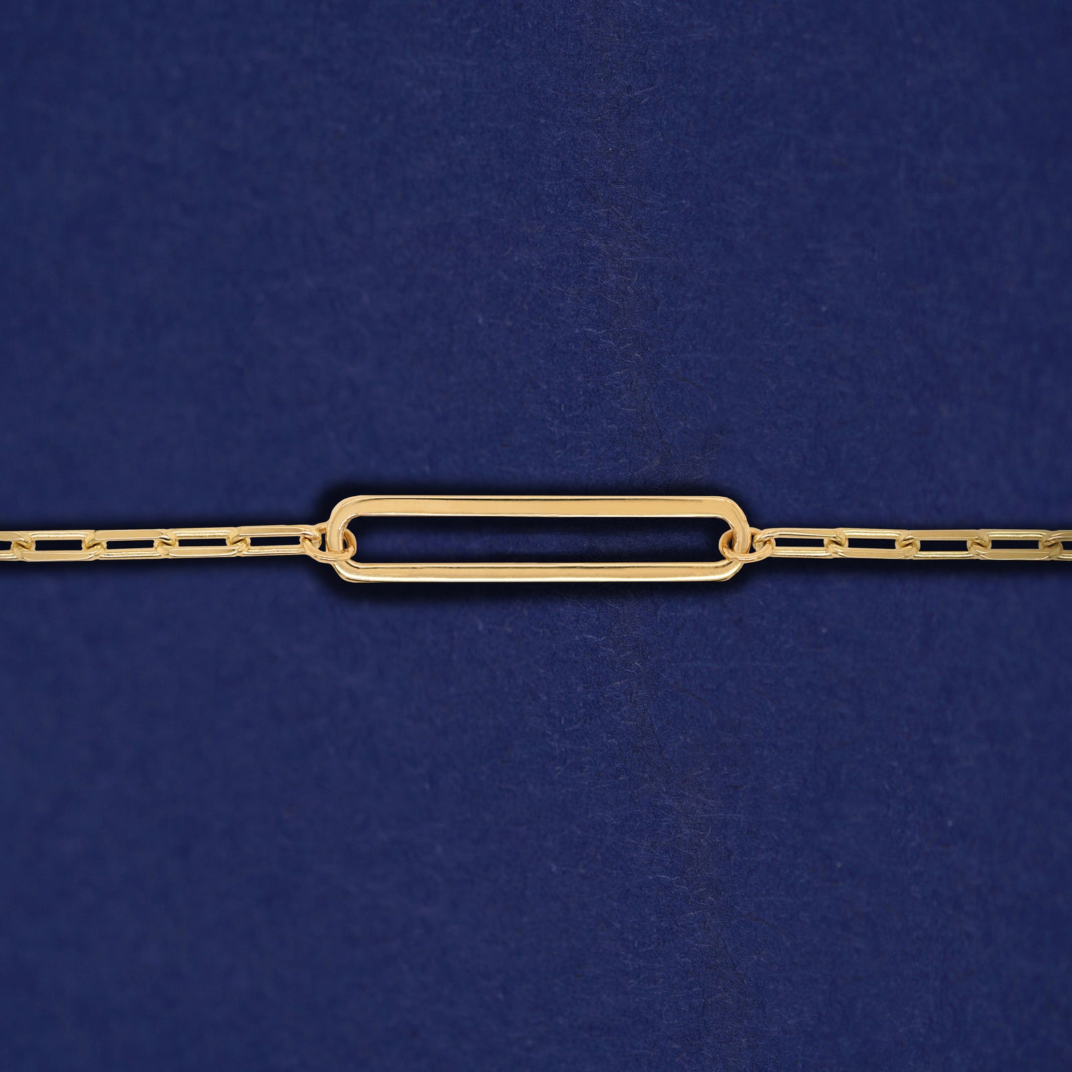 A yellow gold elongated open oval link on a 14k gold Butch chain bracelet