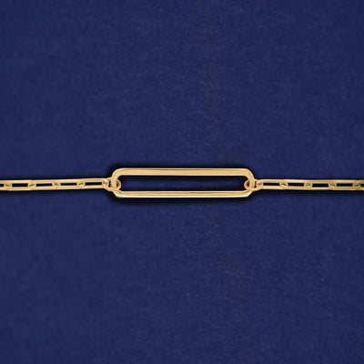 A yellow gold elongated open oval link on a 14k gold Butch chain bracelet