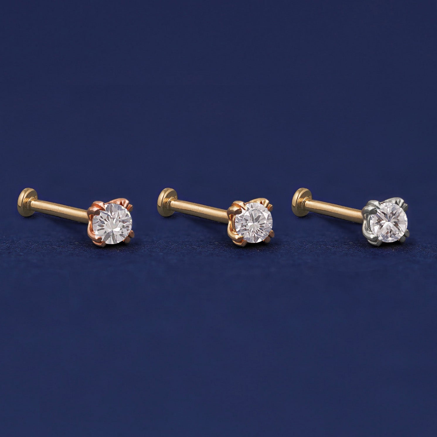 Three versions of the Moissanite Flat Back Earring shown in options of rose, yellow, and white gold