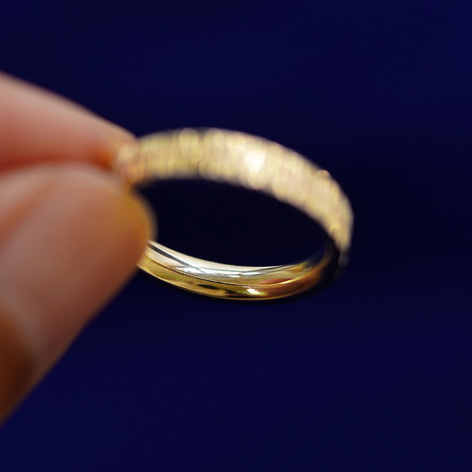 Underside view of a solid 14k gold Industrial Wood Band