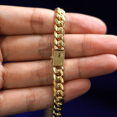 Close up view of the Miami Chain Box Clasp that is engraved to say N Y C in the standard block font