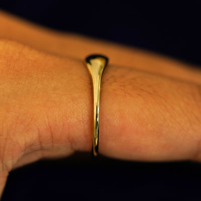Side view of a Puffy Elongated Signet Ring on a model's finger