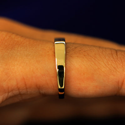 Side view of a Rectangular Signet Ring on a model's finger