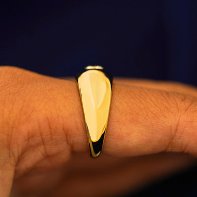 Side view of a Round Lab Diamond Puffy Signet Ring on a model's finger to show details