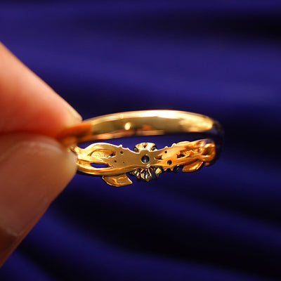 Underside view of a solid 14k gold Green Sapphire Leaves and Vines Ring