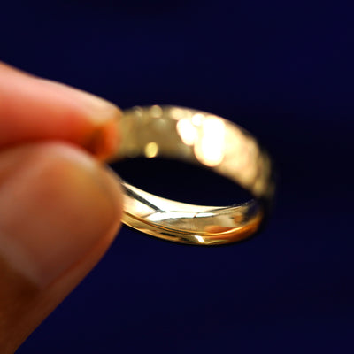 Underside view of a solid 14k gold Industrial Hammered Band