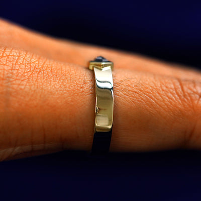 Side view of a Hexagon Diamond Band on a model's finger