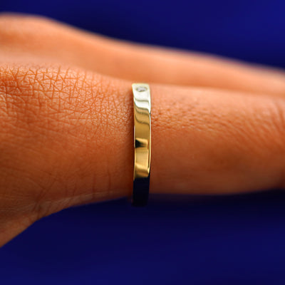 Side view of a Open Industrial Band on a model's finger