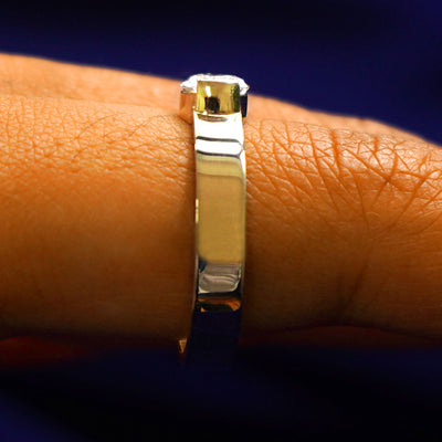 Side view of a Lab Diamond Pear Ring on a model's finger