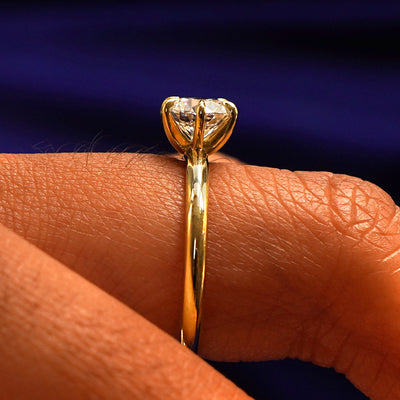 Side view of a Round Lab Diamond Ring on a model's finger