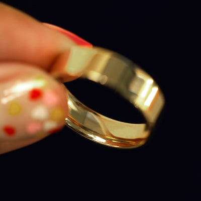 Underside view of a solid 14k gold Industrial Mirror Band