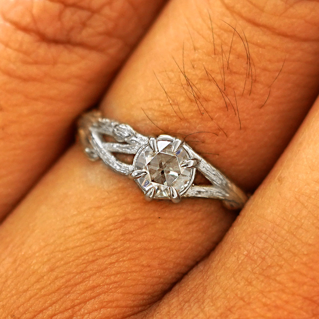 Close up view of a model's fingers wearing a 14k white gold Moissanite Branches Ring