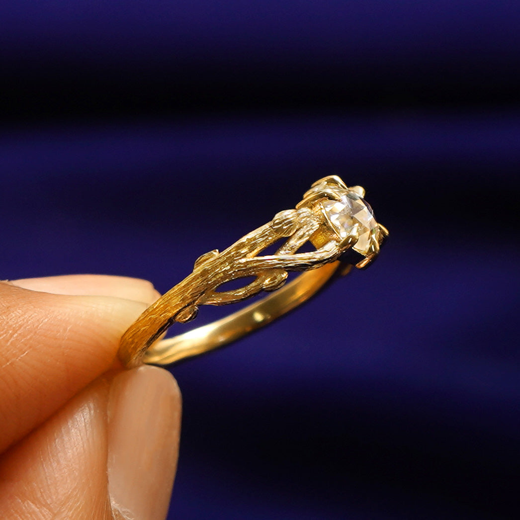 Side view of a Moissanite Branches Ring showing three braided tree branches going to the center stone