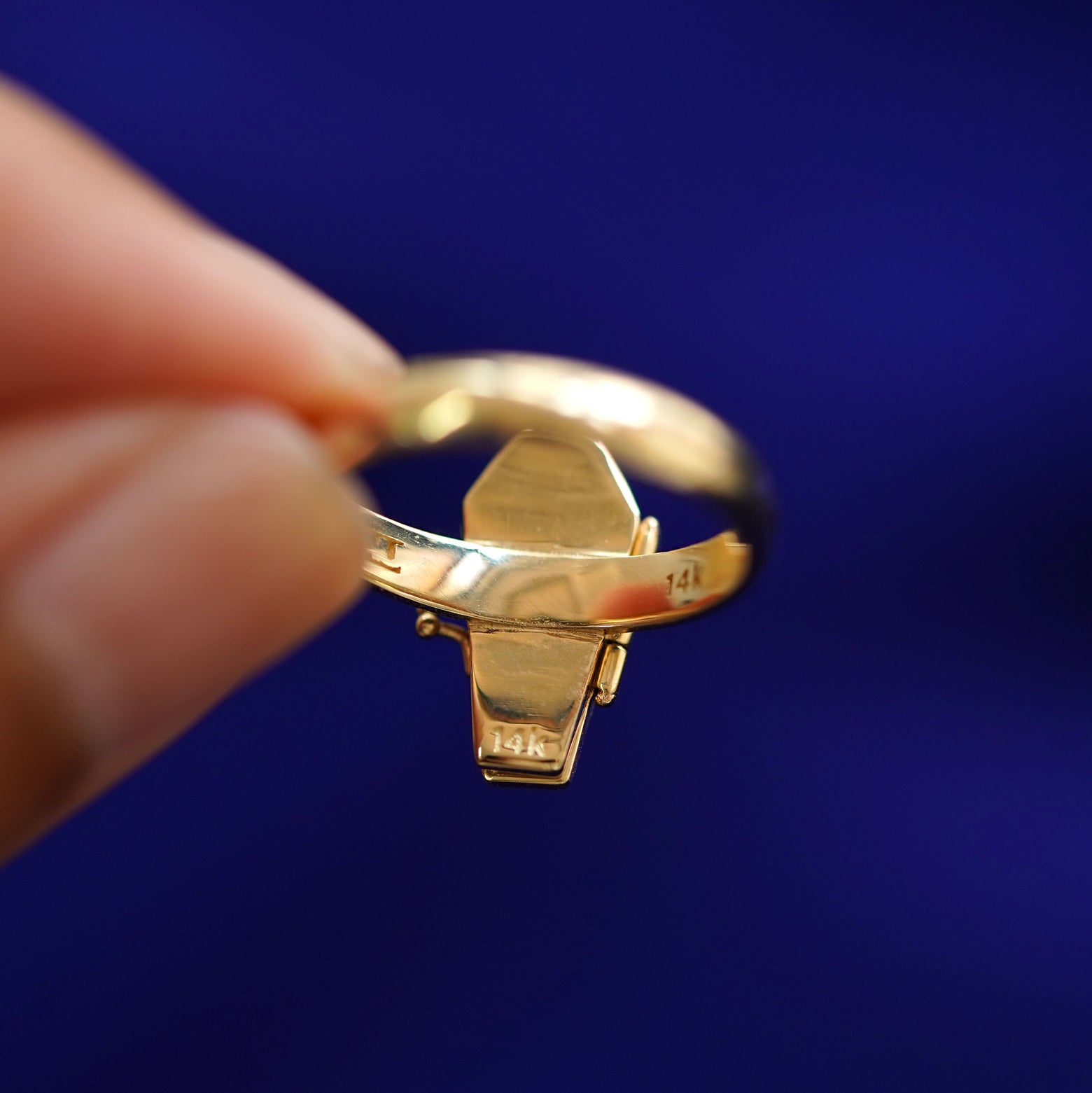 Underside view of a solid 14k gold Coffin Ring