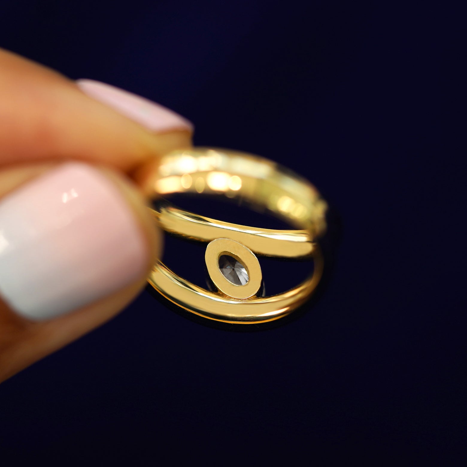 Underside view of a solid 14k gold Oval Lab Diamond Tension Ring