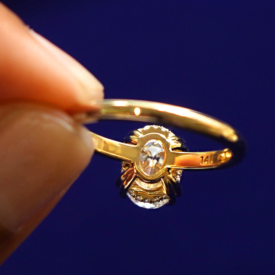 Underside view of a solid 14k gold Oval Moissanite Halo Ring