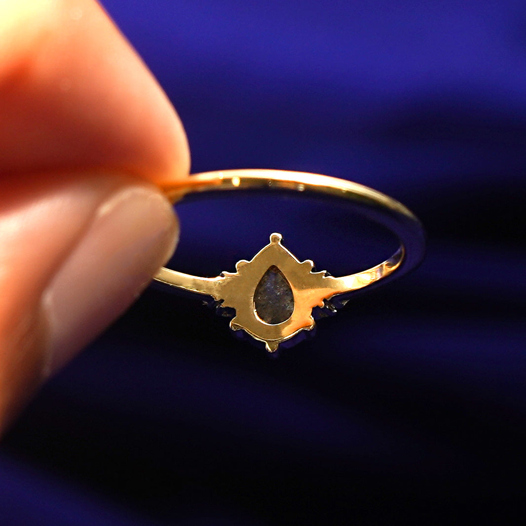 Underside view of a solid 14k gold Pear Salt and Pepper Diamond Ring